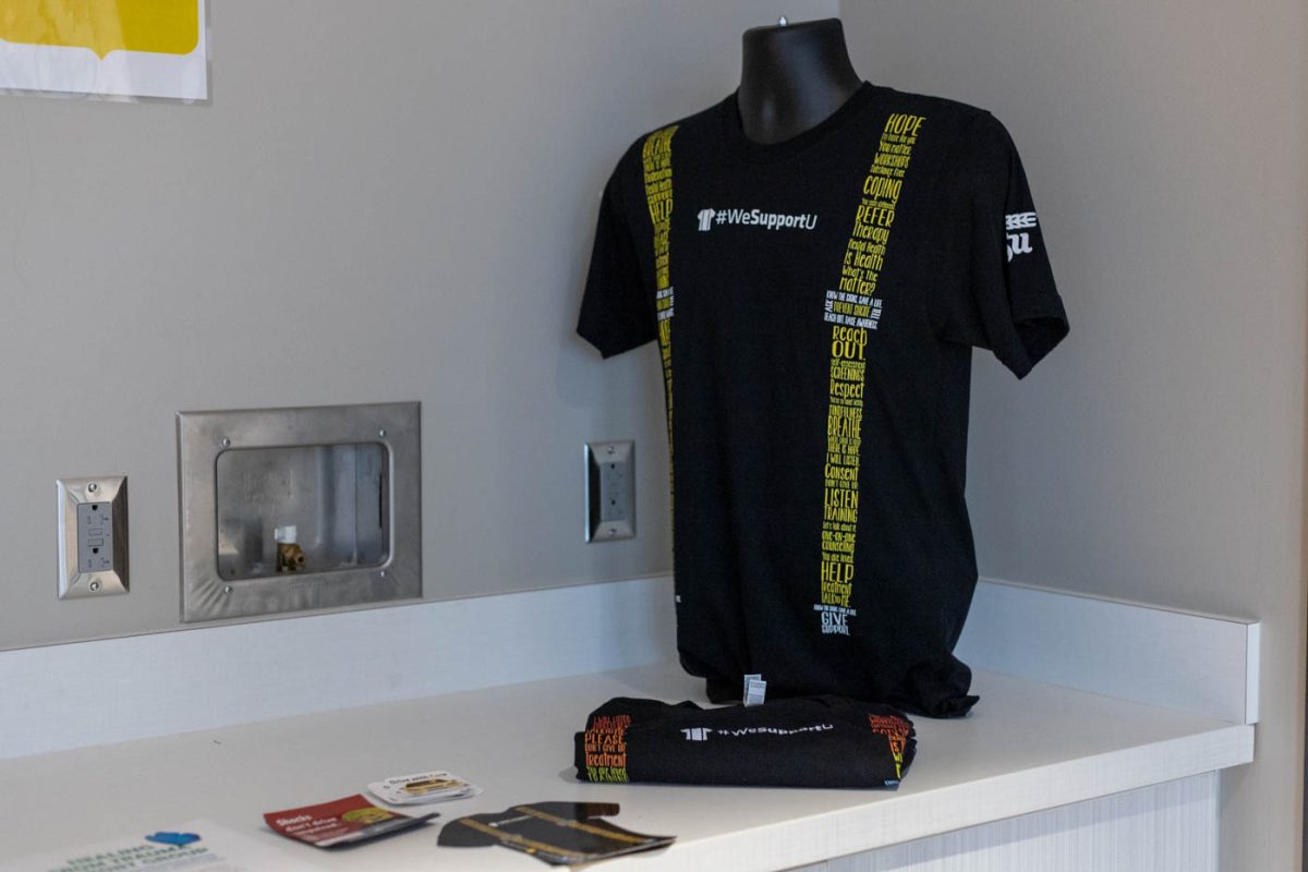 HOPE Services displays the #WeSupportU suspenders t-shirt along with some handouts inside their office. The Health Outreach Prevention and Education (HOPE) Services are located inside the Student Wellness Center at the Steve Clark YMCA.
