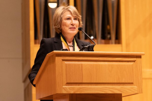 Mona Nemer gives a speech at the Fairmount College of Liberal Arts and Sciences Hall of Fame induction on Feb. 6 in Wiedemann Hall.